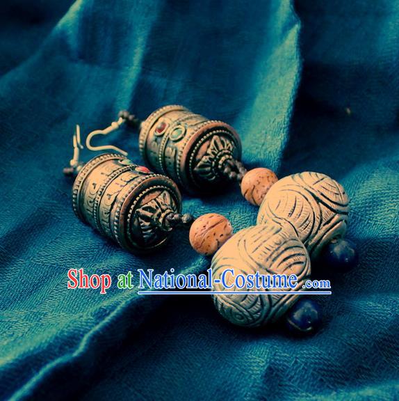 Chinese Handmade Miao Nationality Prayer Wheel Earrings Traditional Minority Ethnic Carving Silver Ear Accessories for Women