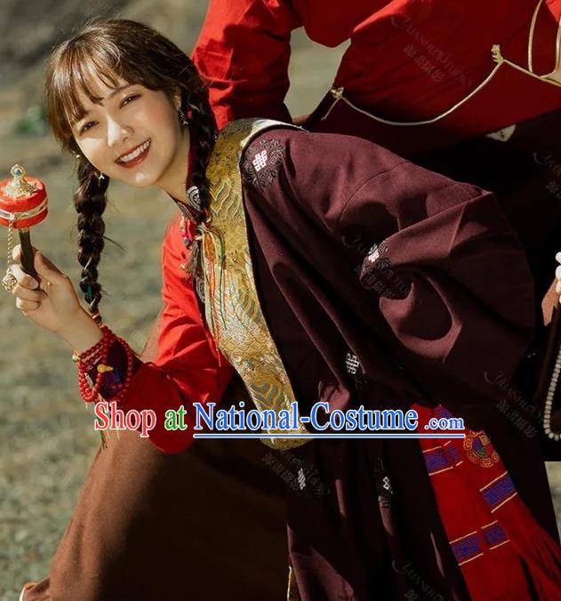 China Traditional Xizang Minority Young Lady Wine Red Tibetan Robe Zang Nationality Folk Dance Clothing