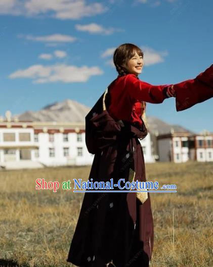 China Traditional Xizang Minority Young Lady Wine Red Tibetan Robe Zang Nationality Folk Dance Clothing