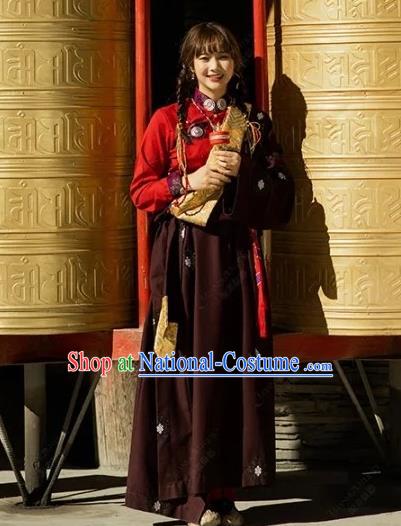 China Traditional Xizang Minority Young Lady Wine Red Tibetan Robe Zang Nationality Folk Dance Clothing