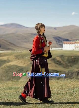 China Traditional Xizang Minority Young Lady Wine Red Tibetan Robe Zang Nationality Folk Dance Clothing